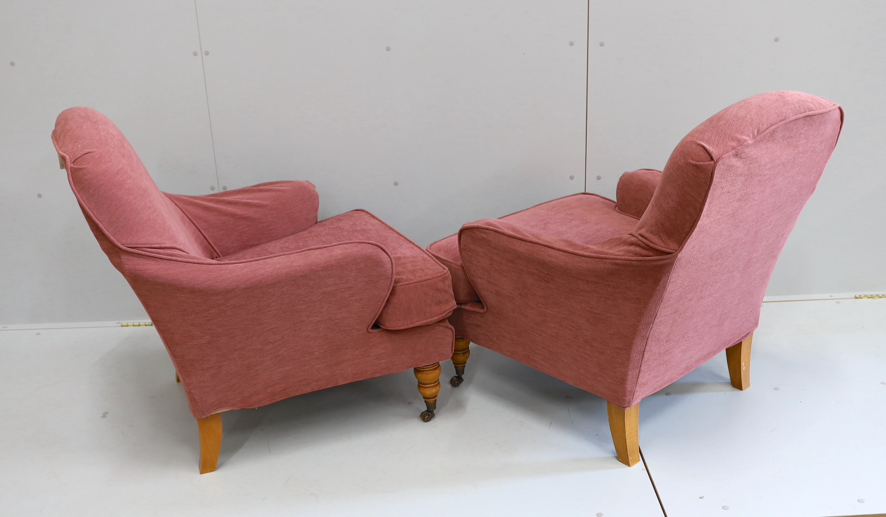A pair of modern French upholstered armchairs, silk covered with later loose covers, width 74cm, depth 80cm, height 87cm